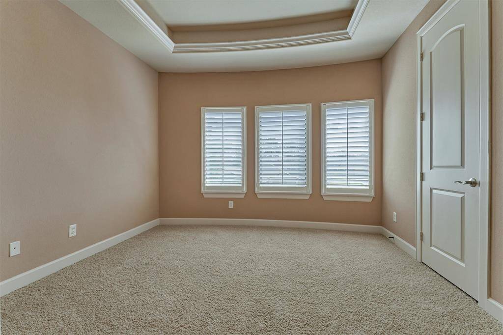 A third bedroom features custom shutters which overlooks the front yard. A double door closet provides ample storage.