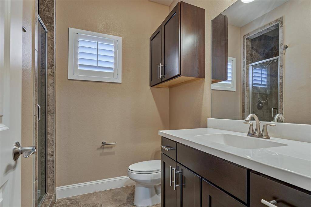 A full bath on the third floor next to the third bedroom. Each bedroom in this home has its own full bath.
