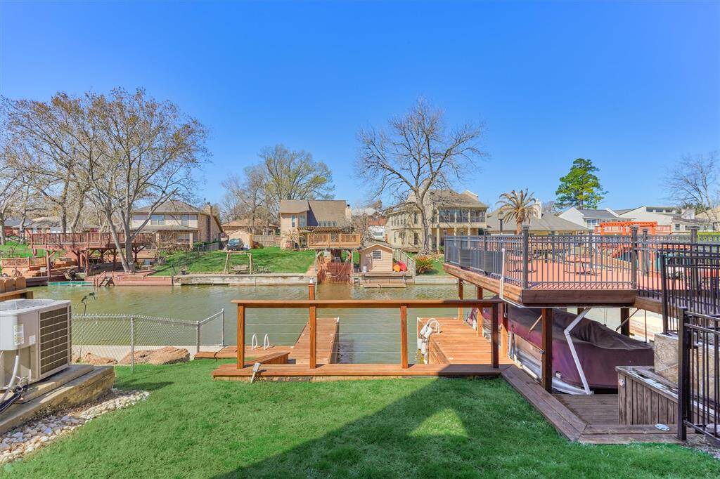 The covered back porch offers a shaded place to relax and enjoy the outdoors and is just a short walk to your boat slip.