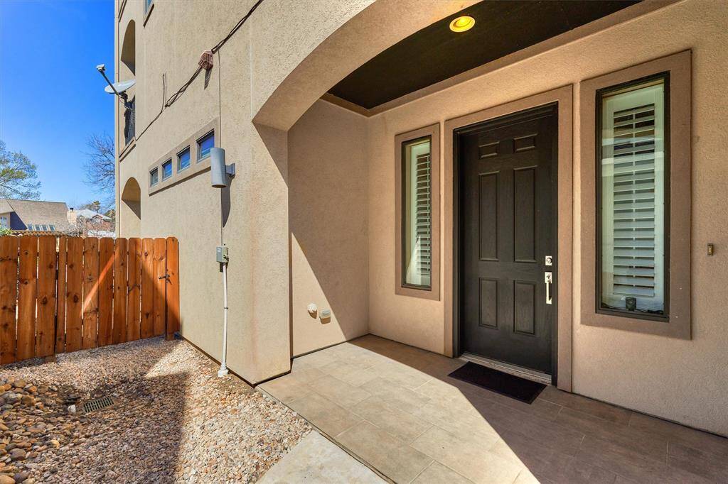 The side entry has a covered porch area.