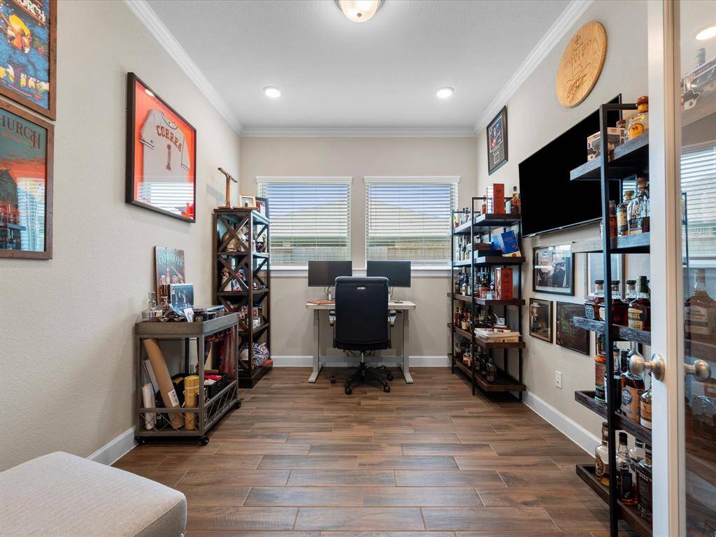 Sophisticated study with stylish French doors and plenty of room for furnishings and organization, offering a functional and productive workspace.