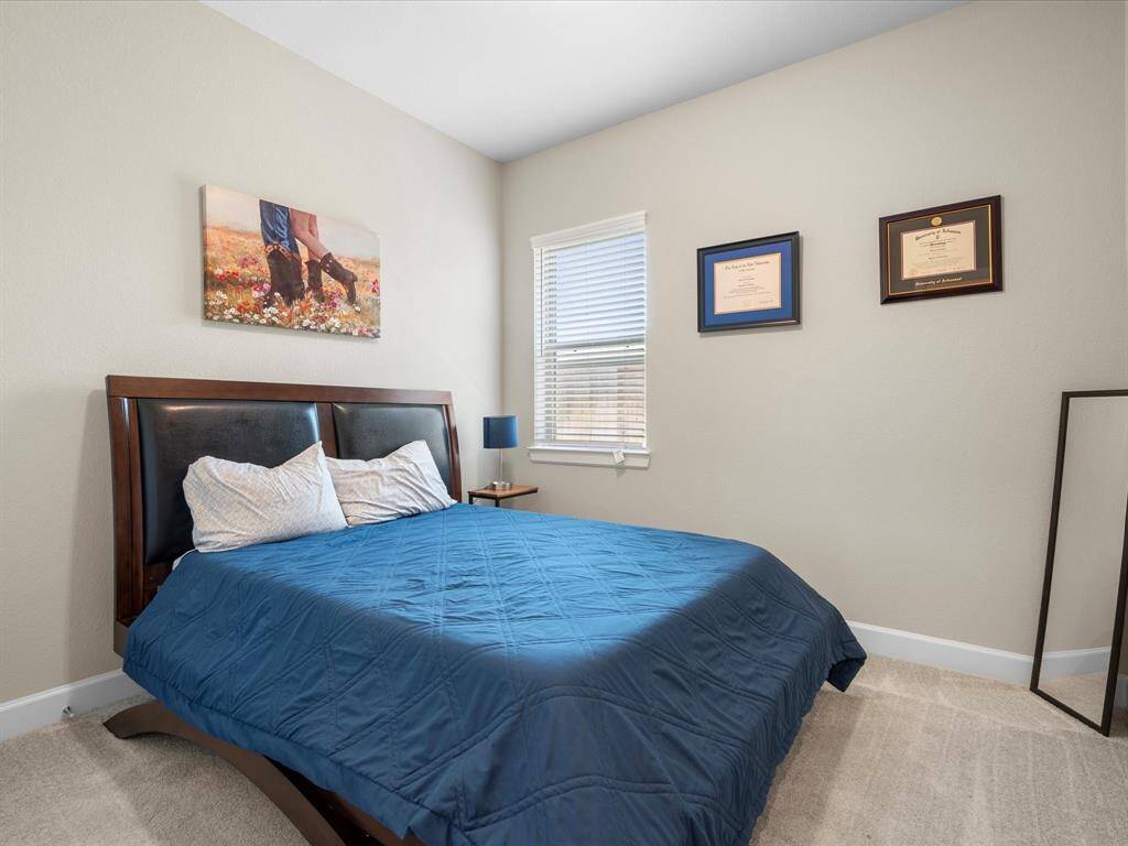 Spacious secondary bedroom with generous closet space offering ample storage space and located right off the well-appointed secondary bathroom.
