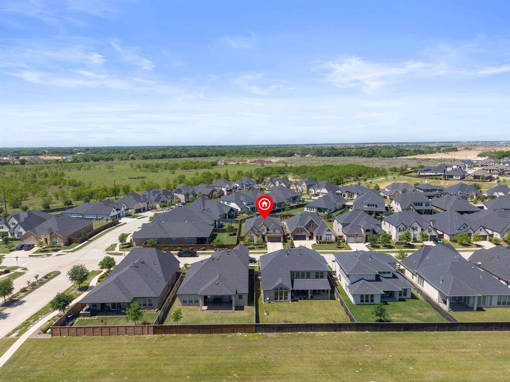 Stunning aerial view of the home, highlighting its prime location and beautifully landscaped surroundings.