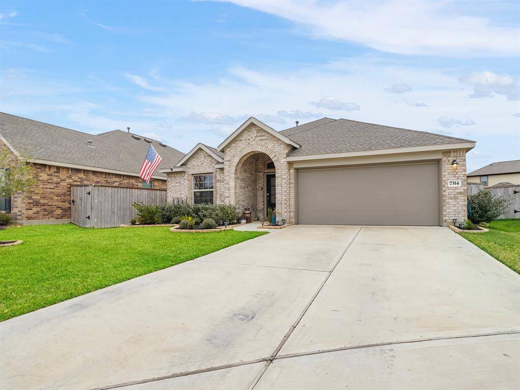 This home features a convenient attached two-car garage, providing abundant parking space and excellent storage options for your needs.