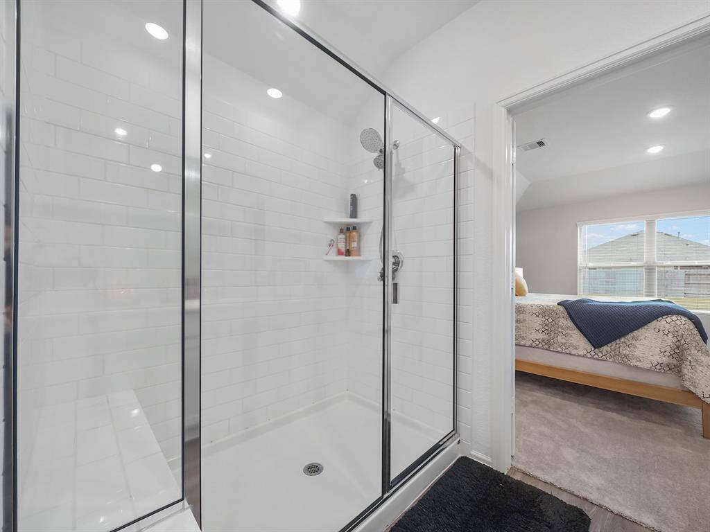 Large shower features built in bench.