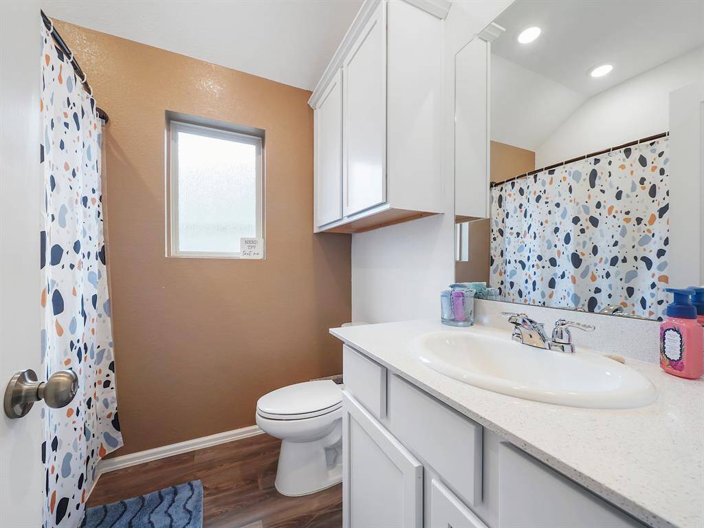Spacious secondary bathroom conveniently situated between two secondary bedrooms for easy access.