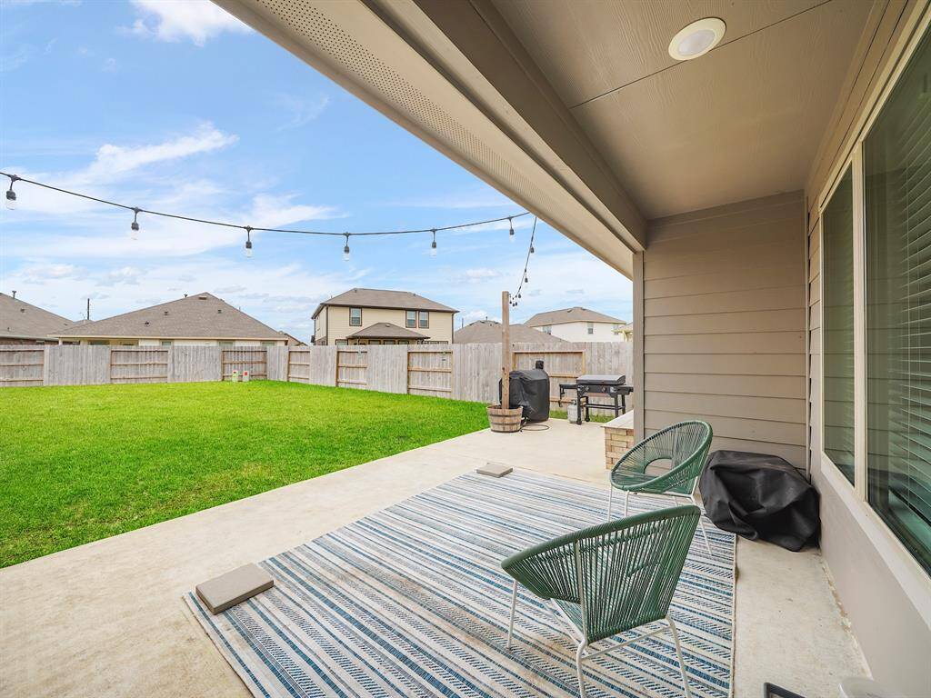 Enjoy the expansive back patio, ideal for grilling and outdoor furniture. Perfect for entertaining or relaxing, this space enhances your outdoor living experience and offers endless possibilities for gatherings.