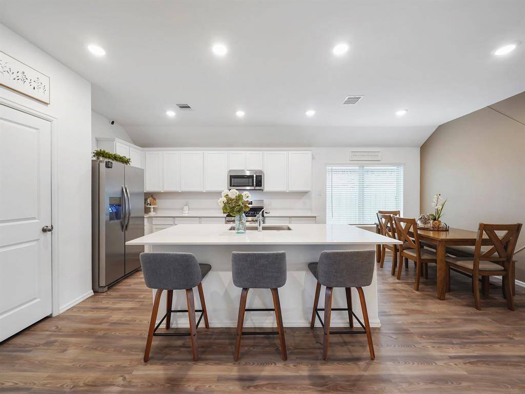 Spacious kitchen featuring abundant storage and generous counter space, highlighted by a stunning expansive island.