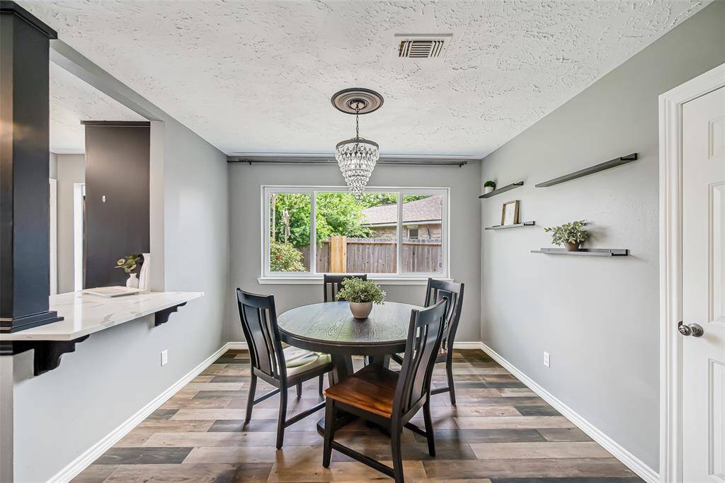This dining area is a cozy and sunny spot for a quick cup of coffee or leisurely dinner.