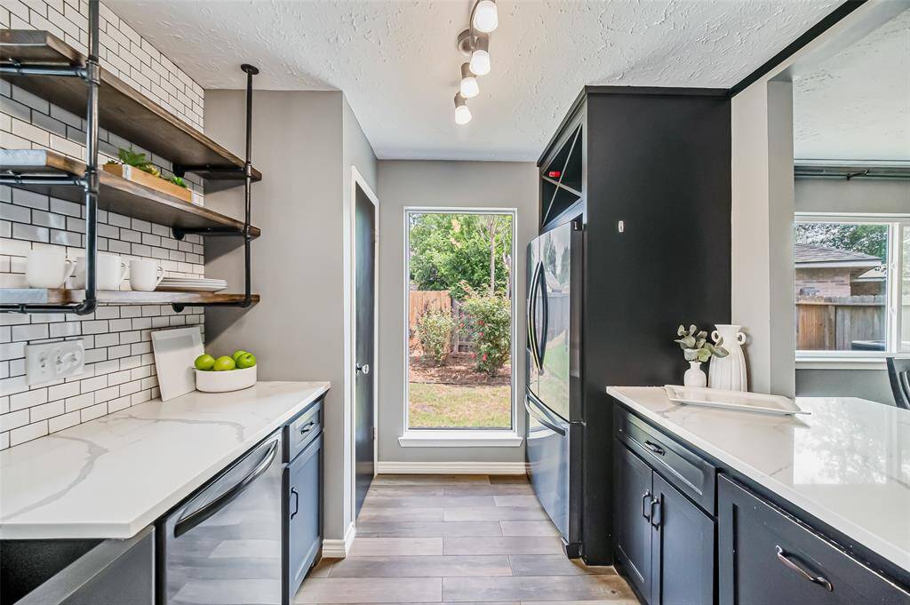 Large windows make this a sunny kitchen that will be a joy to cook in.