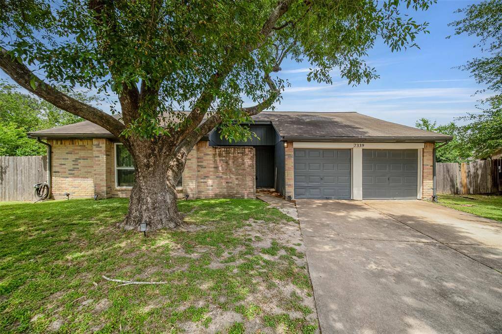 In addition to the two-car attached garage, the double driveway affords extra parking.