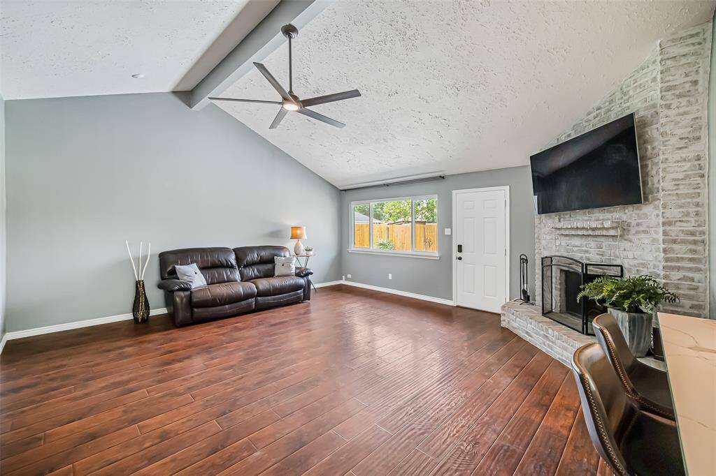 Step inside the light and bright home and be greeted by neutral paint and gleaming floors in this wonderful and large family room.