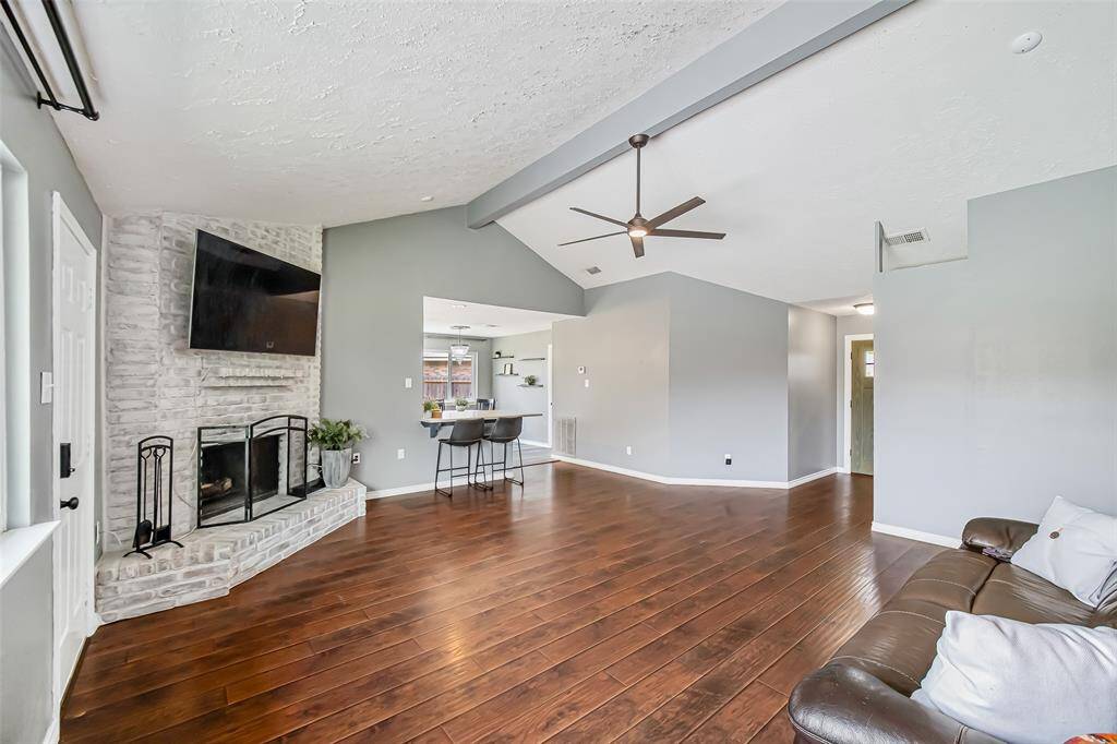 At left is the gorgeous white-washed fireplace.  The home has a well-designed and comfortable floorplan.