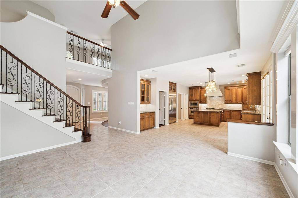 The living room conveniently flows right into the culinary space and breakfast area for effortless entertaining and living.