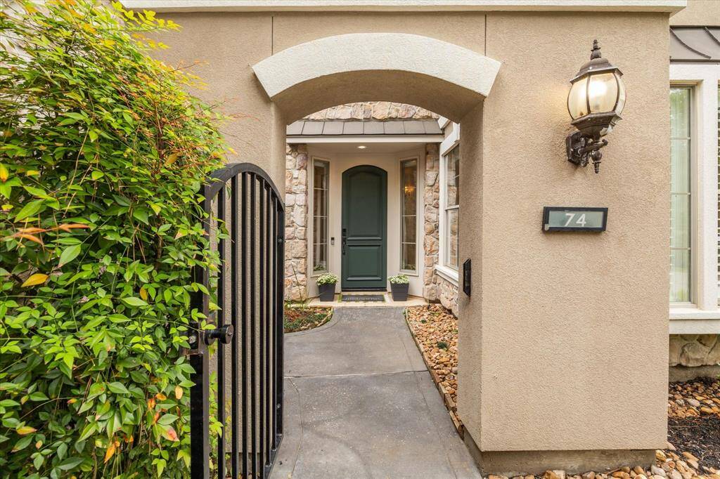 The gated front courtyard creates a serene and private entryway, adding both charm and appeal as guests arrive at the front door.