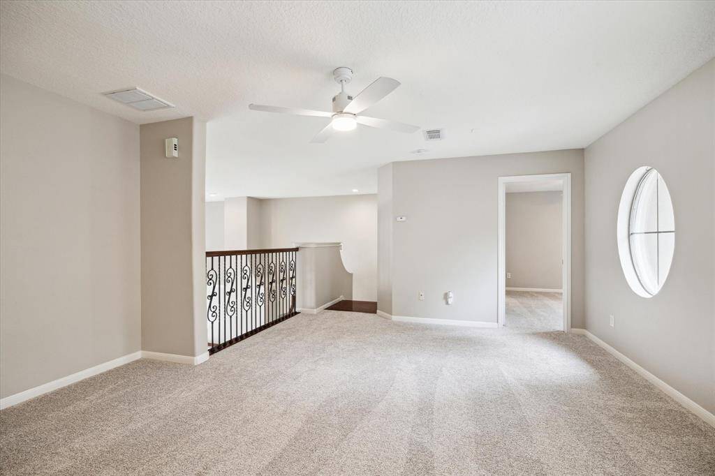 The second level features a game room and three bedrooms, each with an en-suite bathroom.