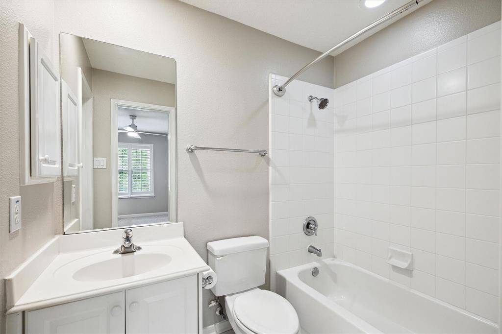 Secondary full bathroom and the walk-in closet is positioned to the left.