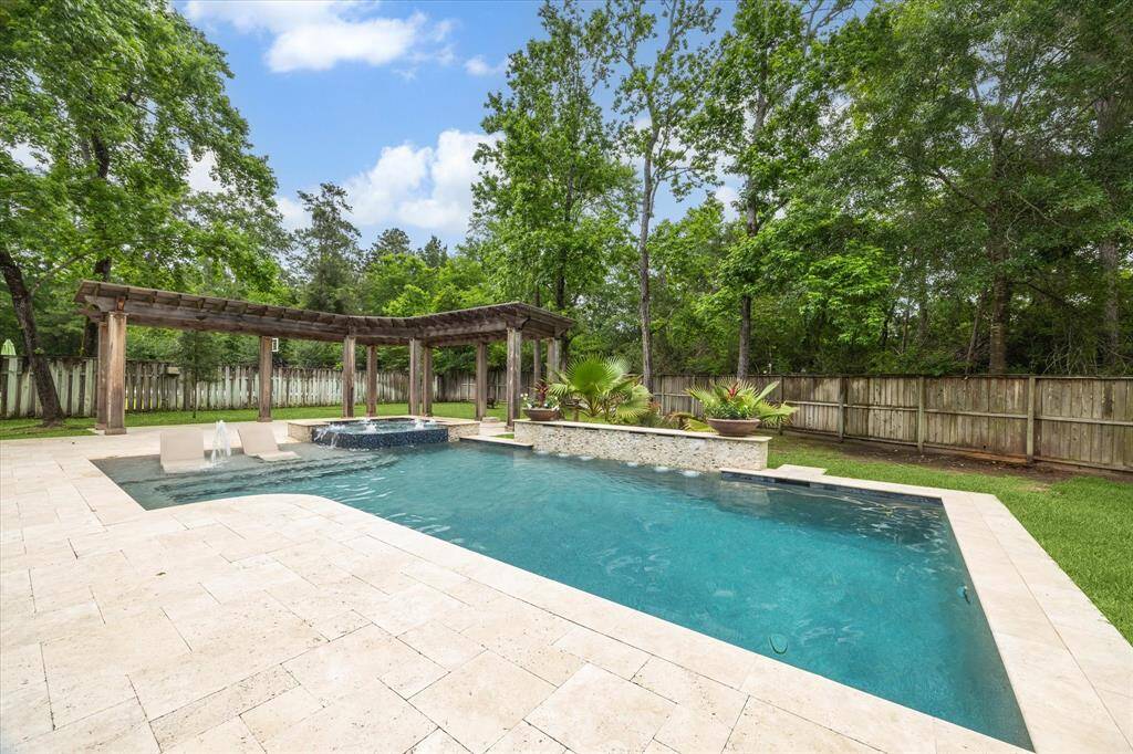 New custom Pool Concepts pool and spa bejewels the oversized backyard which measures almost half an acre!