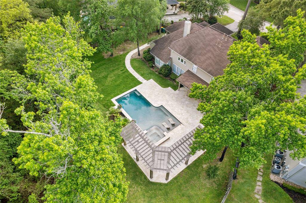 This aerial view highlights the property's expansive layout and exceptional privacy, with no rear neighbors, but backs to the rarely traveled Stoneyhurst!