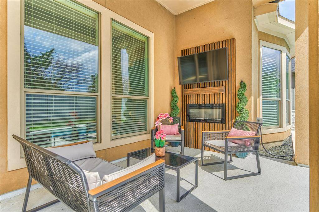 Cozy up on your back porch by the electric fireplace!