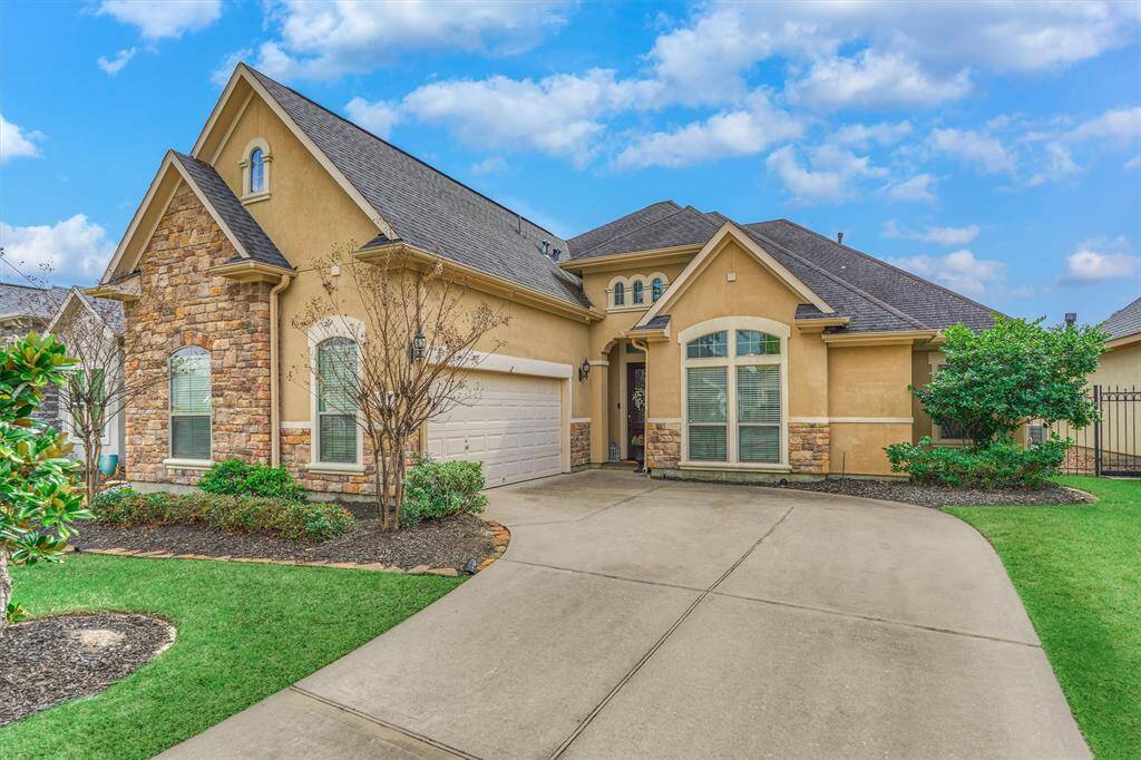 Beautiful stone detail and complementary stucco exterior.  Oversized garage that fits 2 cars plus so much storage.