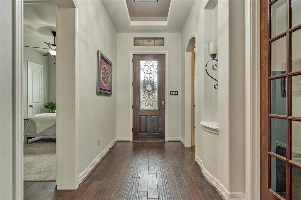 Alternate view looking back at the front door with the guest room to the left and study to the right.