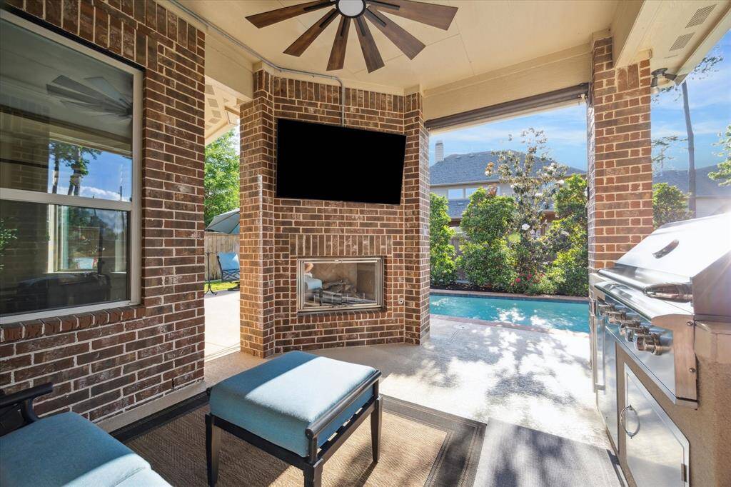 Outdoor fireplace and outdoor kitchen.