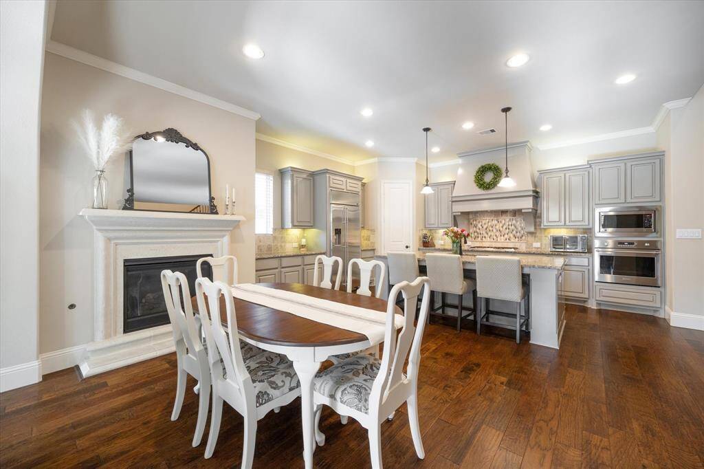 Dining area with cozy gaslog fireplace.