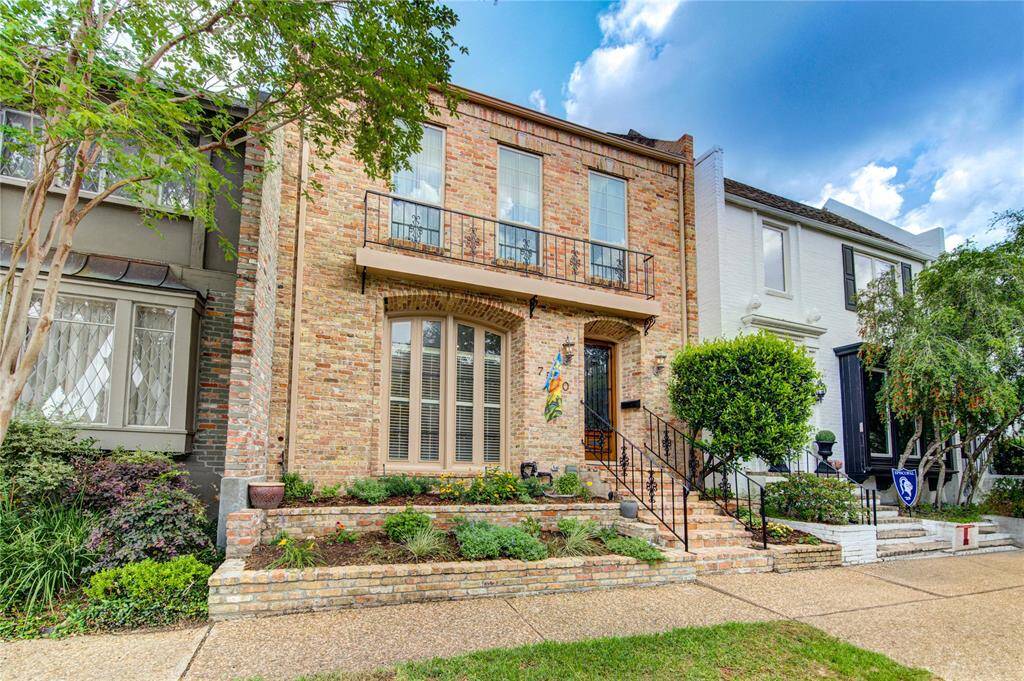 Lovely brick facade and beautiful landscaping!