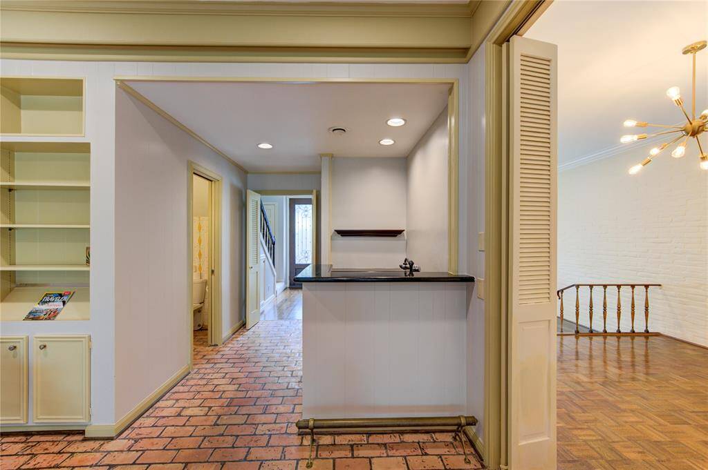 Wet bar (center) and half bath (left).
