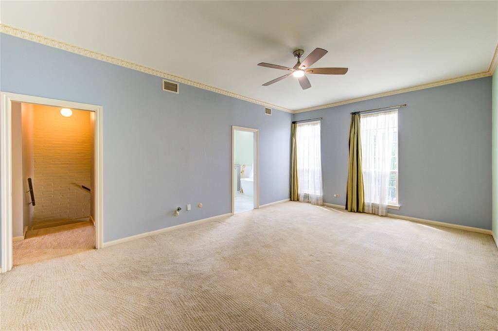 Another view of the primary bedroom.