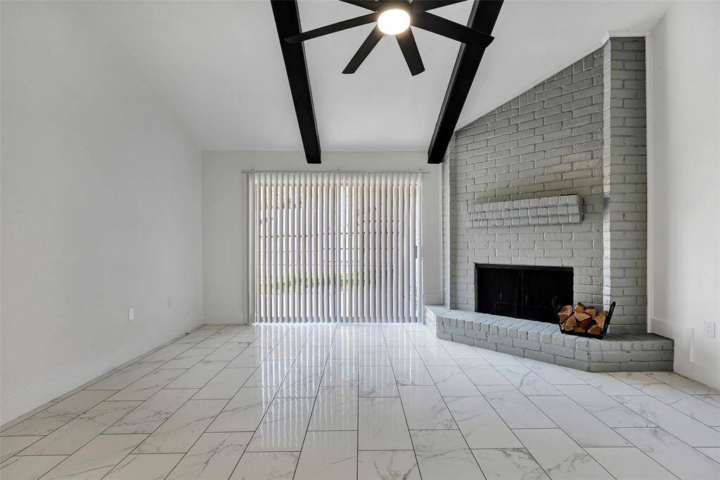 The large window in the family room offers a lovely view of the backyard, bringing in plenty of natural light and connecting the space to the outdoors.