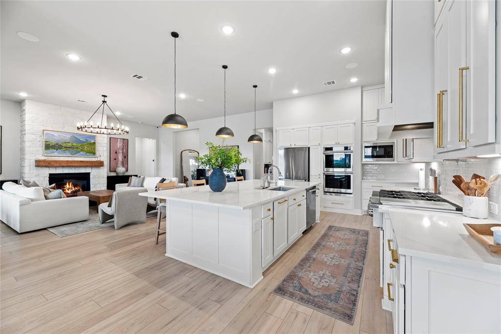 The open feel of the home, where the kitchen, breakfast area, and living room flow together seamlessly, is absolutely wonderful!