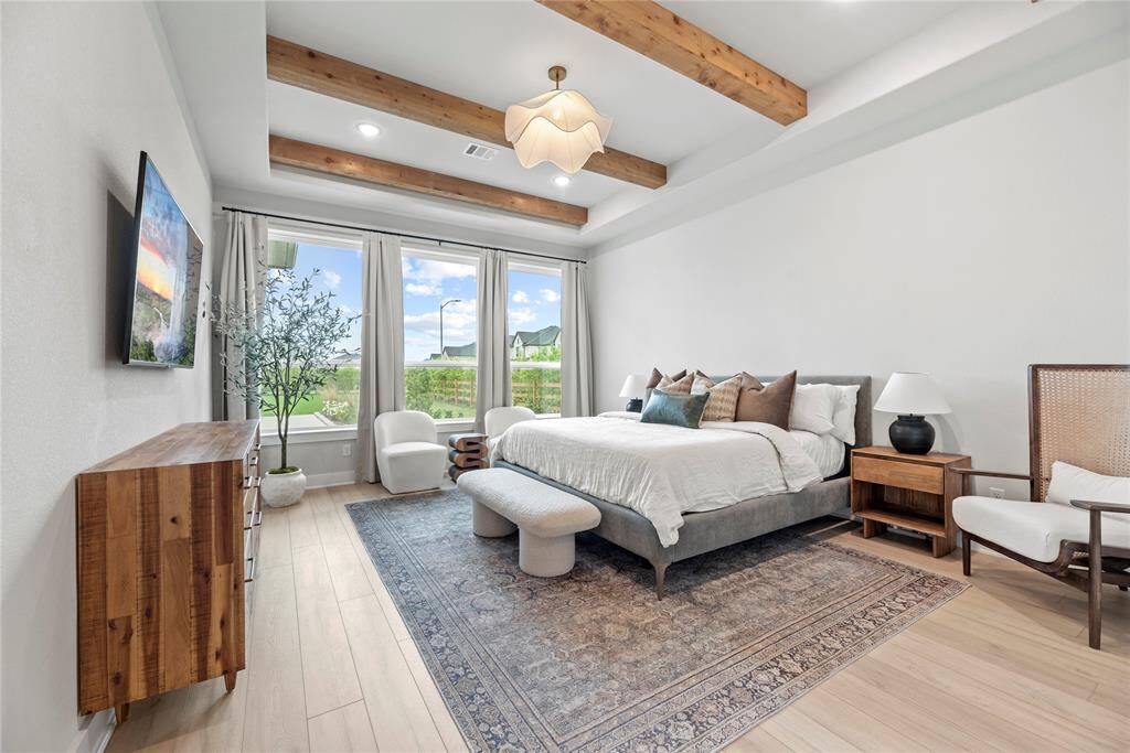 How perfect is this primary suite? Spacious and filled with natural light, this serene retreat offers the ultimate escape, promising comfort, tranquility, and pure relaxation.