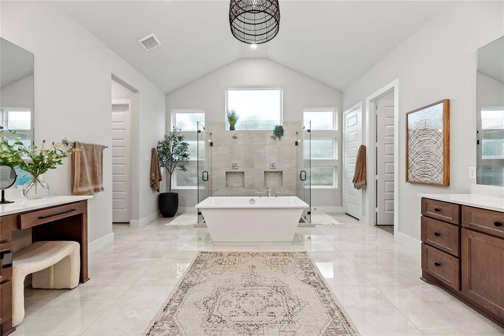 This elegantly designed primary bath combines both functionality and style, transforming your daily routine into a spa-like experience.