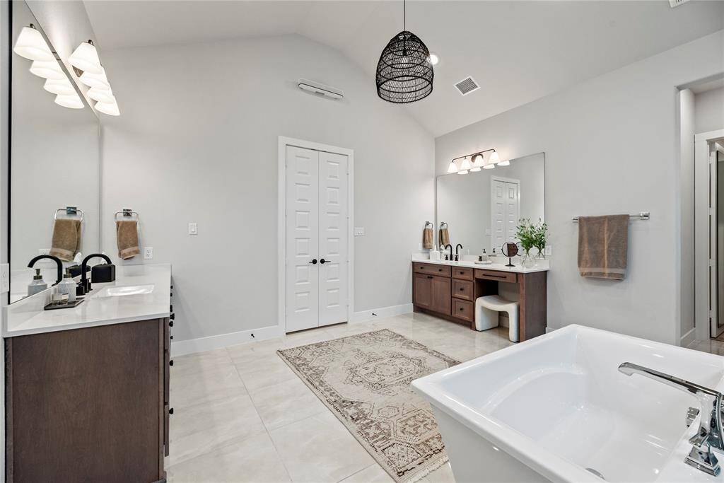 Dual vanities in your primary bath, offer personal space with tons of dedicated cabinet space.