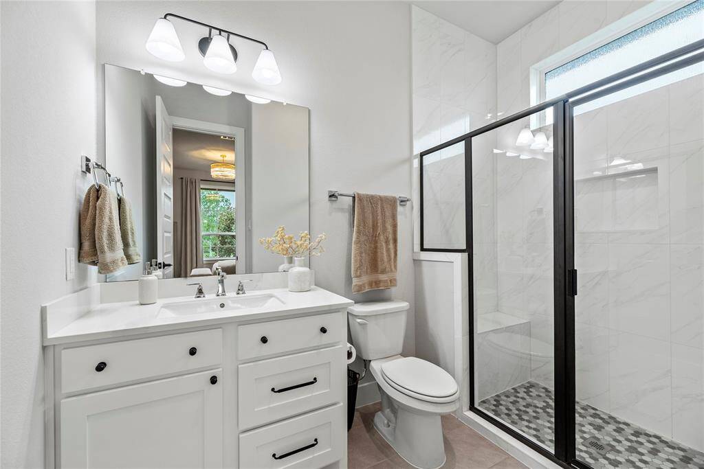 The dedicated private full bath for your 2nd bedroom with walk-in shower.