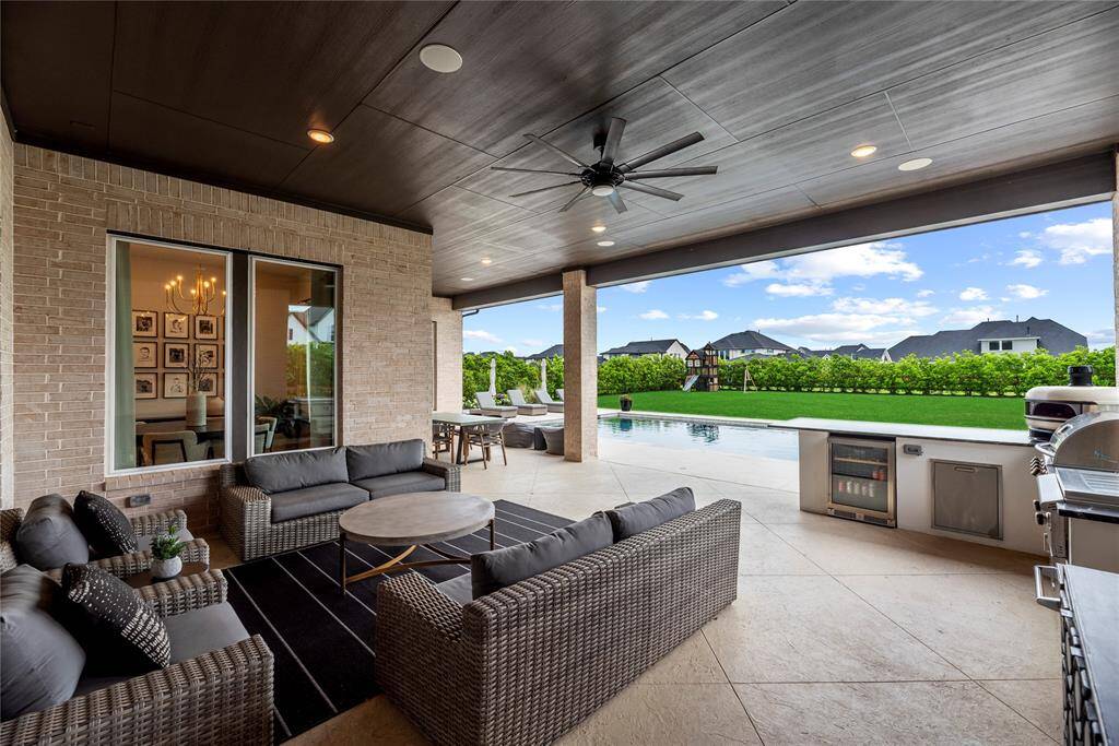 Now this is where the fun begins! The extended, covered patio with outdoor kitchen is a great place to barbecue for family and friends.