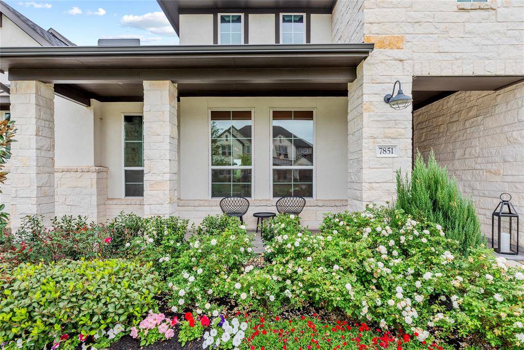 The charming front porch provides the perfect spot to relax and unwind, offering a peaceful place to sit and take in the sights and sounds of the neighborhood. Whether you're enjoying a morning coffee, reading a book, or simply watching the world go by, this inviting space makes for a serene retreat right at your doorstep.
