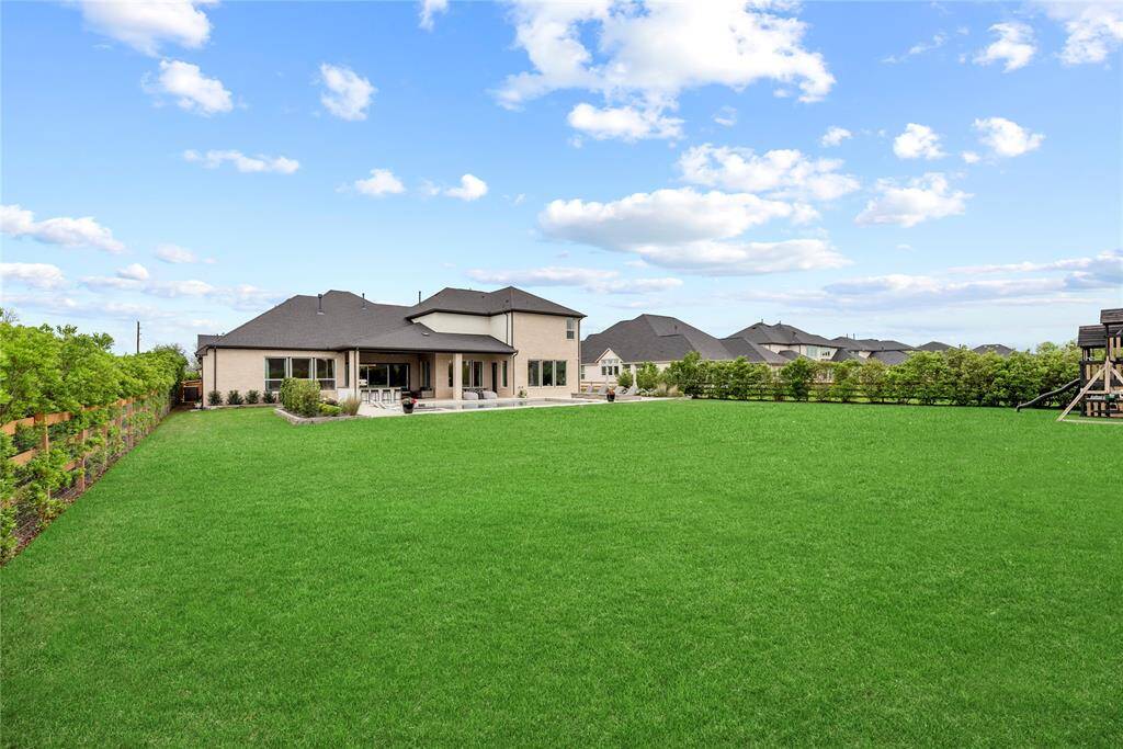 Oversized backyard perfect for pets, play, and outdoor entertaining—offering plenty of space for fun, relaxation, and endless possibilities.