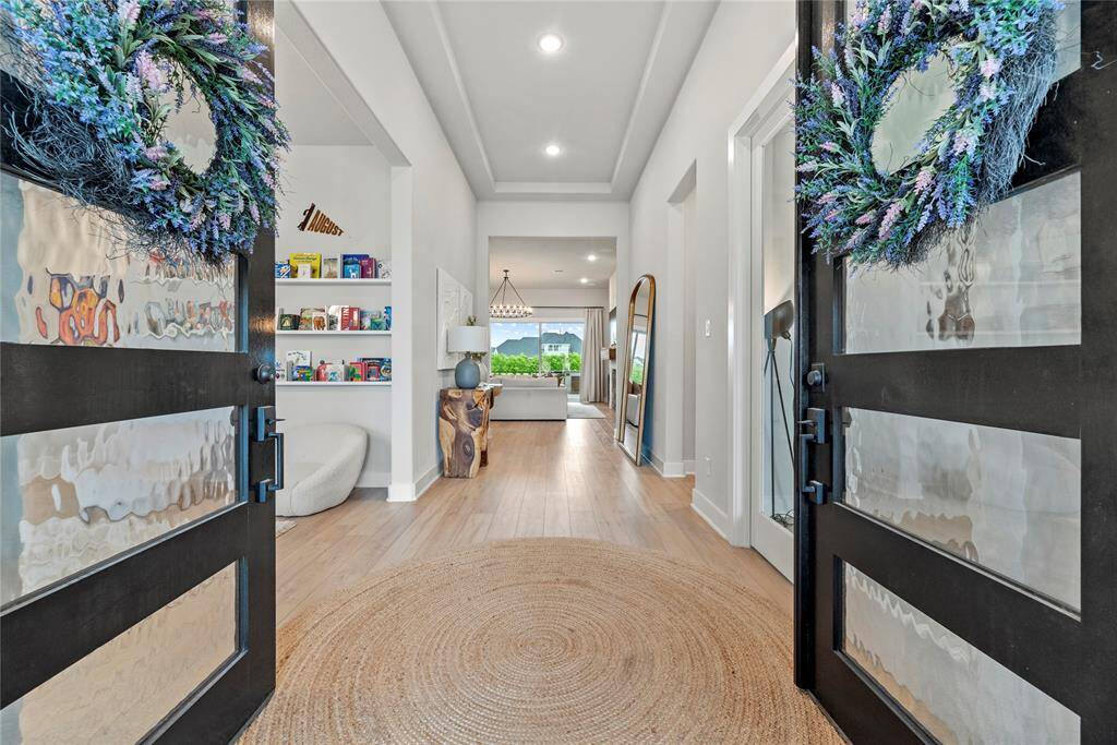 As you step through the elegant double leaded glass doors, you're welcomed into a home where luxury and thoughtful design await at every turn.