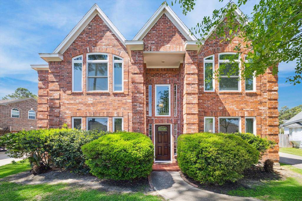 Elegant brick residence nestled in the desirable Memorial Northwest community.
