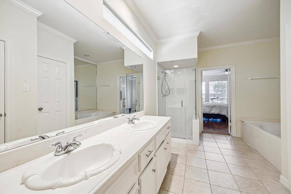 Spacious primary bathroom with a dual vanity.