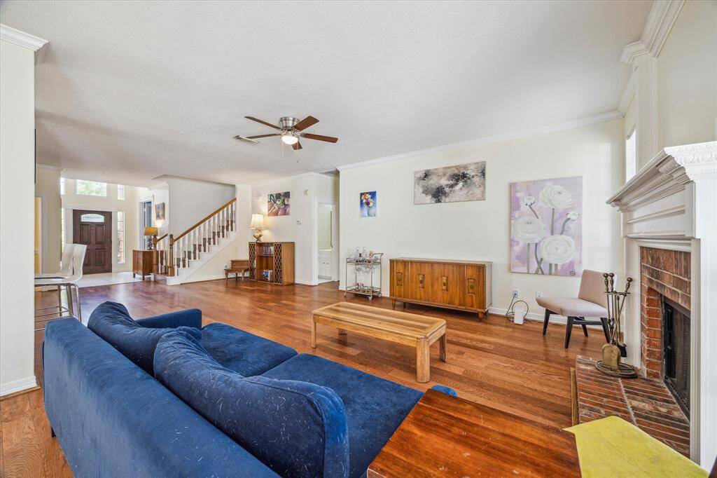 Expansive family room conveniently located off the kitchen, offering an open-concept layout.