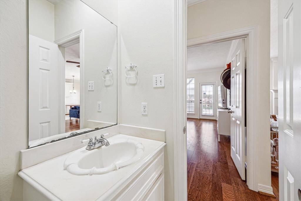 Convenient half bath located downstairs, perfect for guests and added functionality.
