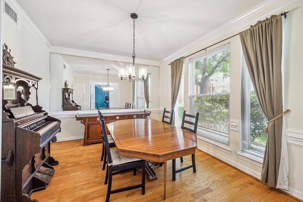 Formal dining room situated off the entryway, highlighted by expansive windows.
