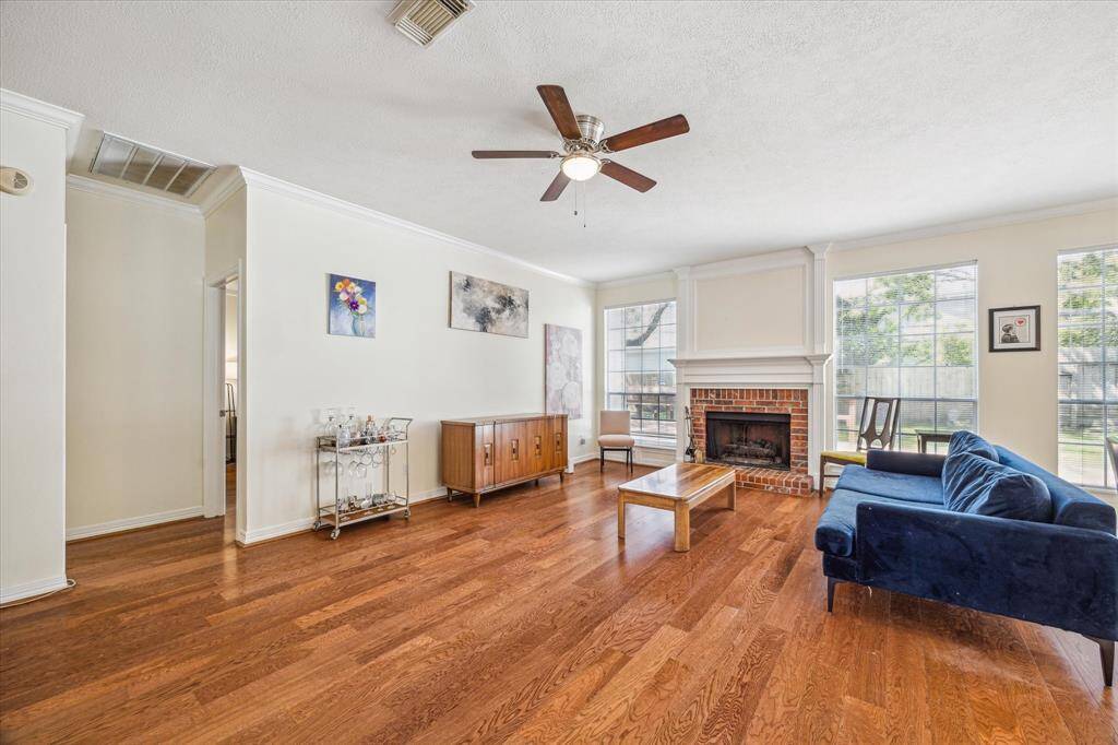 Cozy family room anchored by a gas log fireplace—perfect for relaxing evenings and gatherings.