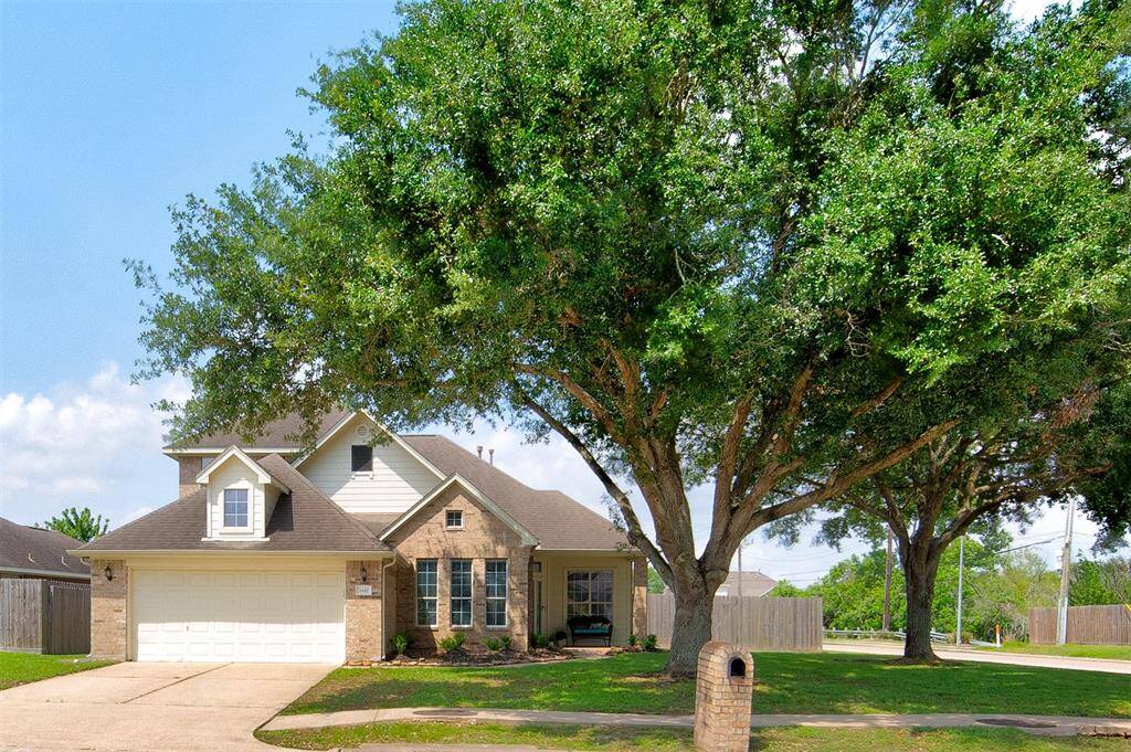 Stately front elevation with 2 car garage.