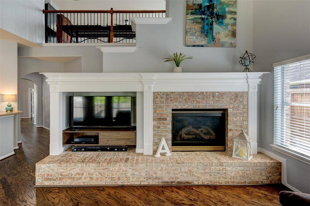 Impressive built in entertainment center and gas log fireplace in the family room.