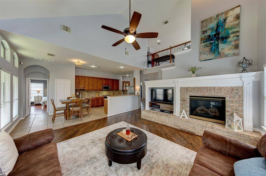 Family room and kitchen seamlessly adjoin for optimum entertaining.